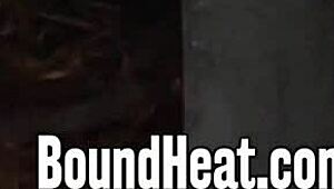 Mistress dominates bound lesbian slaves, whipping tits in garage punishment session