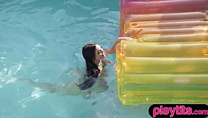 Curvy MILF with big tits strips nude in the pool, exposing her big wet ass.