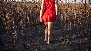 Hot MILF teases with sexy thong ass in short skirt outdoors.