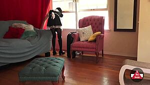 French maid bends over while vacuuming in tight skirt and stockings