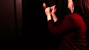 student sucking cock at the gloryhole