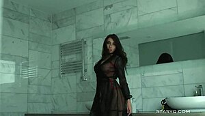 busty russian babe megan teases with big tits in bathtub lingerie