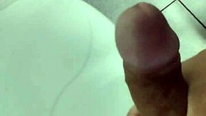 Masturbating alone at work in a solo session.