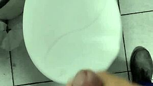 Masturbating alone at work in a solo session.