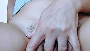 A teen girl fingers her hairy pussy to a shaking orgasm.