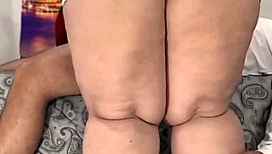 My latina milf kneels and sucks my cock eagerly.