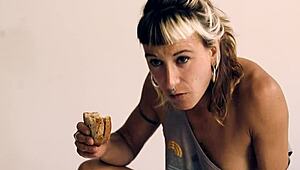 She eats food while riding in reverse cowgirl