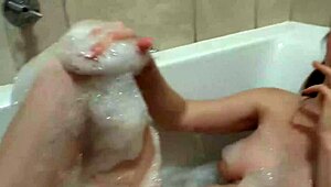 Petite amateur smokes in bath, exposing big tits and beautiful body.