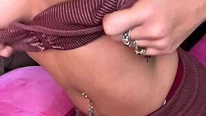 Luna Luxe lounges on the couch teasing her shaved pussy with pink vibrator