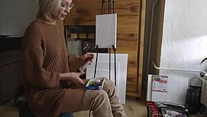 blonde babe paints a flower on her pussy while showing off ass, boots, and tits 😍