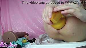Skinny girl explores huge dildo in anal fetish play