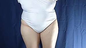 one piece swimsuit try on goes uncensored with big tits.