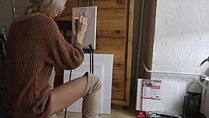 blonde babe paints a flower on her pussy while showing off ass, boots, and tits 😍