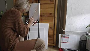 blonde babe paints a flower on her pussy while showing off ass, boots, and tits 😍