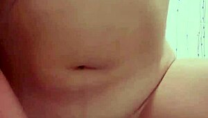 latina gives handjob in bathroom with dildo