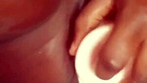 Ebony amateur's solo masturbation with dildo goes viral online.