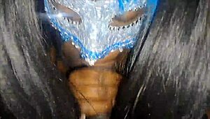 masked ebony receives a facial treatment