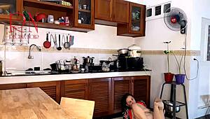 This housewife teases in pantyhose while cooking in kitchen.