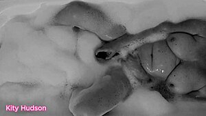 Kity Hudson plays with toy in steamy bath session
