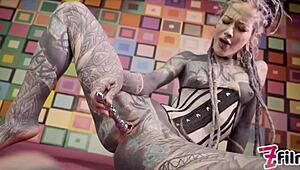 Tattooed Alternative Pornstar Anuskatzz in Corset Plays with Metal Toy