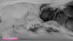 Kity Hudson plays with toy in steamy bath session