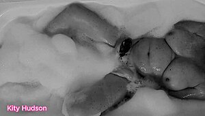 Kity Hudson plays with toy in steamy bath session