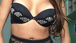 Izabela, the shemale goddess, shows off her big tits and monster cock in lingerie