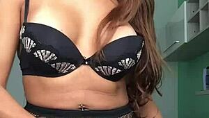 Izabela, the shemale goddess, shows off her big tits and monster cock in lingerie