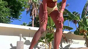 Crazy girl pees on public beach!