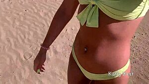 Crazy girl pees on public beach!