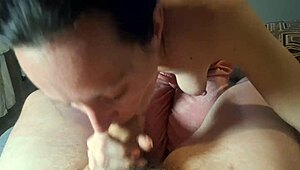 Dark-haired girl sucks and swallows mouthfuls intensely