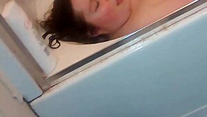 Gloria masturbating with dildo in bathtub