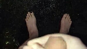 I'm masturbating in the rain, naked with my big cock out