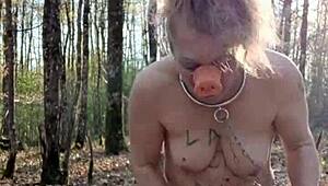 Slave self-spanks outdoors like a sow