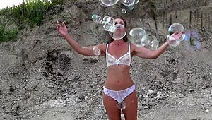 Mature crossdresser feels excited in transparent bikini.