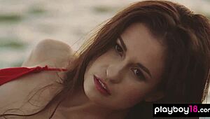 Demi Fray, a petite ukrainian babe, playfully strips naked outdoors