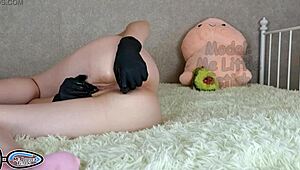 Stepsister in Latex Gloves Pissing with Buttplug in Tight Ass!