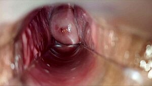 horny woman uses speculum for pulsating orgasm inside vagina.