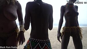 three african tribe witches perform a dancing ritual to make rain
