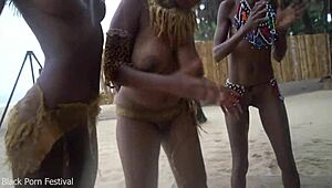 three african tribe witches perform a dancing ritual to make rain