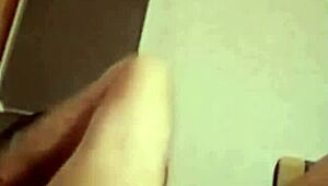 Watch the man jerk off while his woman watches.