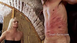 Cruel Blonde MILF Whips Guy's Cock In Femdom