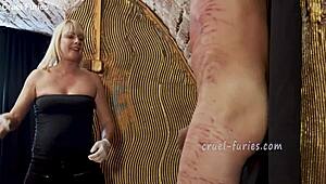 Cruel Blonde MILF Whips Guy's Cock In Femdom