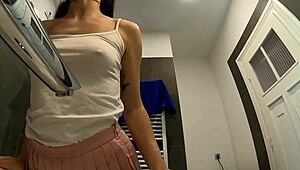 Are you seeing this braless hot brunette babe, all skinny and horny in her pink mini skirt, showing off that ass and legs in the bathroom?