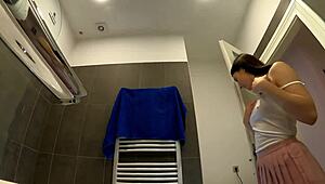 Are you seeing this braless hot brunette babe, all skinny and horny in her pink mini skirt, showing off that ass and legs in the bathroom?