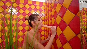 Blonde woman uses anal dildo for solo relaxation in the bathroom