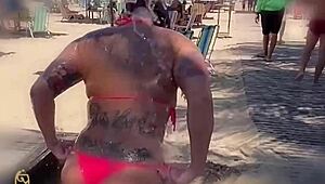 Blonde sucks monster black cock on beach