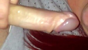 Redhead passionately sucking cock with intense blowjob action