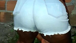 Neighbor with large buttocks cleans the backyard