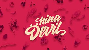 The european redhead wears a fetish outfit.